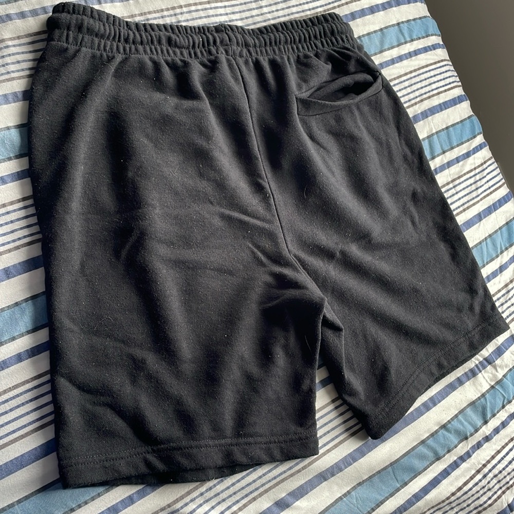 Men’s black shorts from refuge, with drawstrings and pockets.